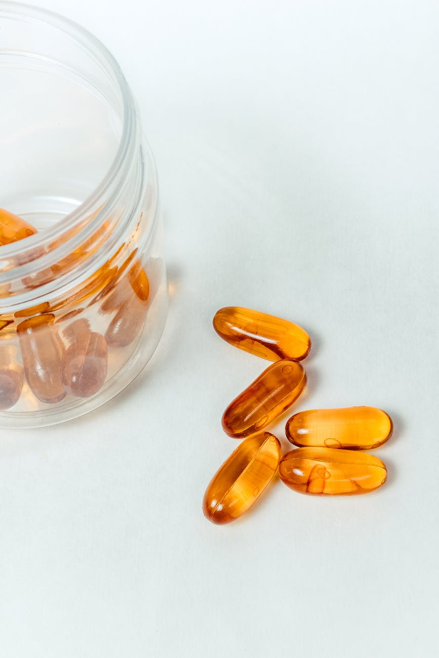 yellow capsules on white background